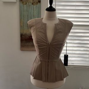 Bebe size small genuine leather peplum top, back is stretchy for comfort